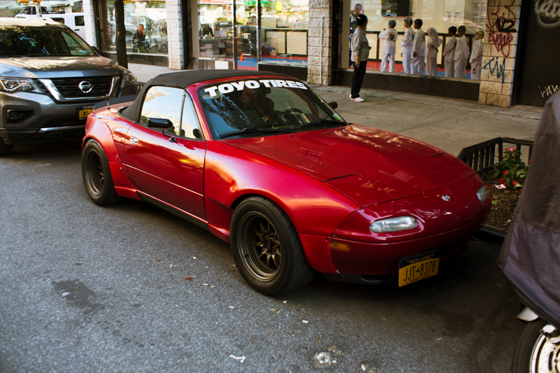 Illustration for article titled Nothing Says Determination Like A Caged Miata Parked In Manhattan